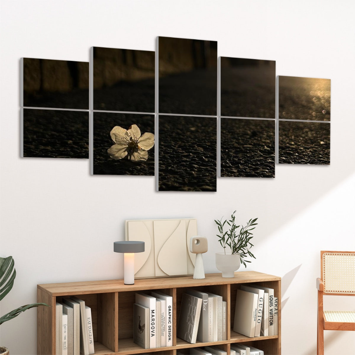 Left-angled view of 10 acoustic wall panels featuring a pale blossom on textured asphalt in full color and warm lighting.