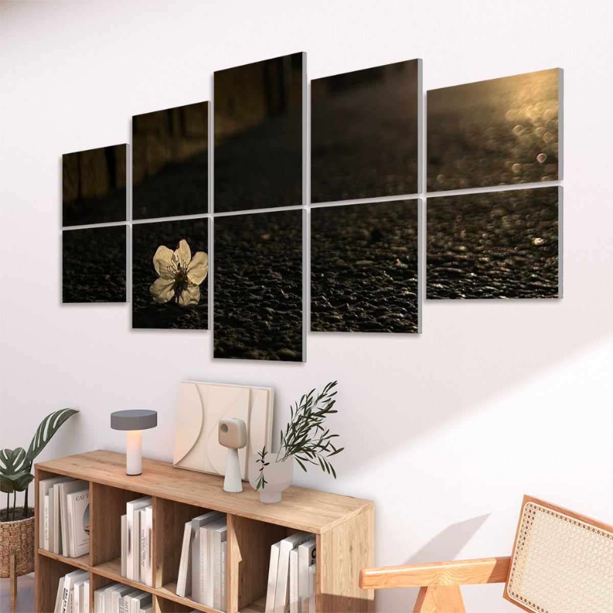 Right-angled view of 10 decorative sound absorbing panels showing a white flower on asphalt with evening light.
