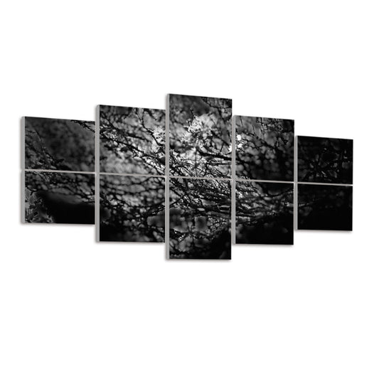 Left-angled view of 10 acoustic wall panels showing dense overlapping branches and light flares