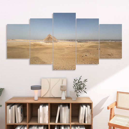 Ten panels in a 2×5 grid on a white wall showing a sandy desert plain and the Pyramids of Giza under a blue sky
