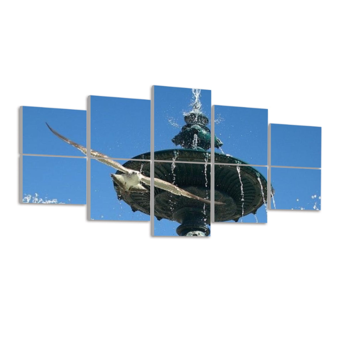 Side view of ten panels displaying the Lisbon fountain and seagull against a white background. The bright blue sky occupies the top panels, while bronze fountain details and water droplets appear below. A seagull’s wingspan crosses multiple panels