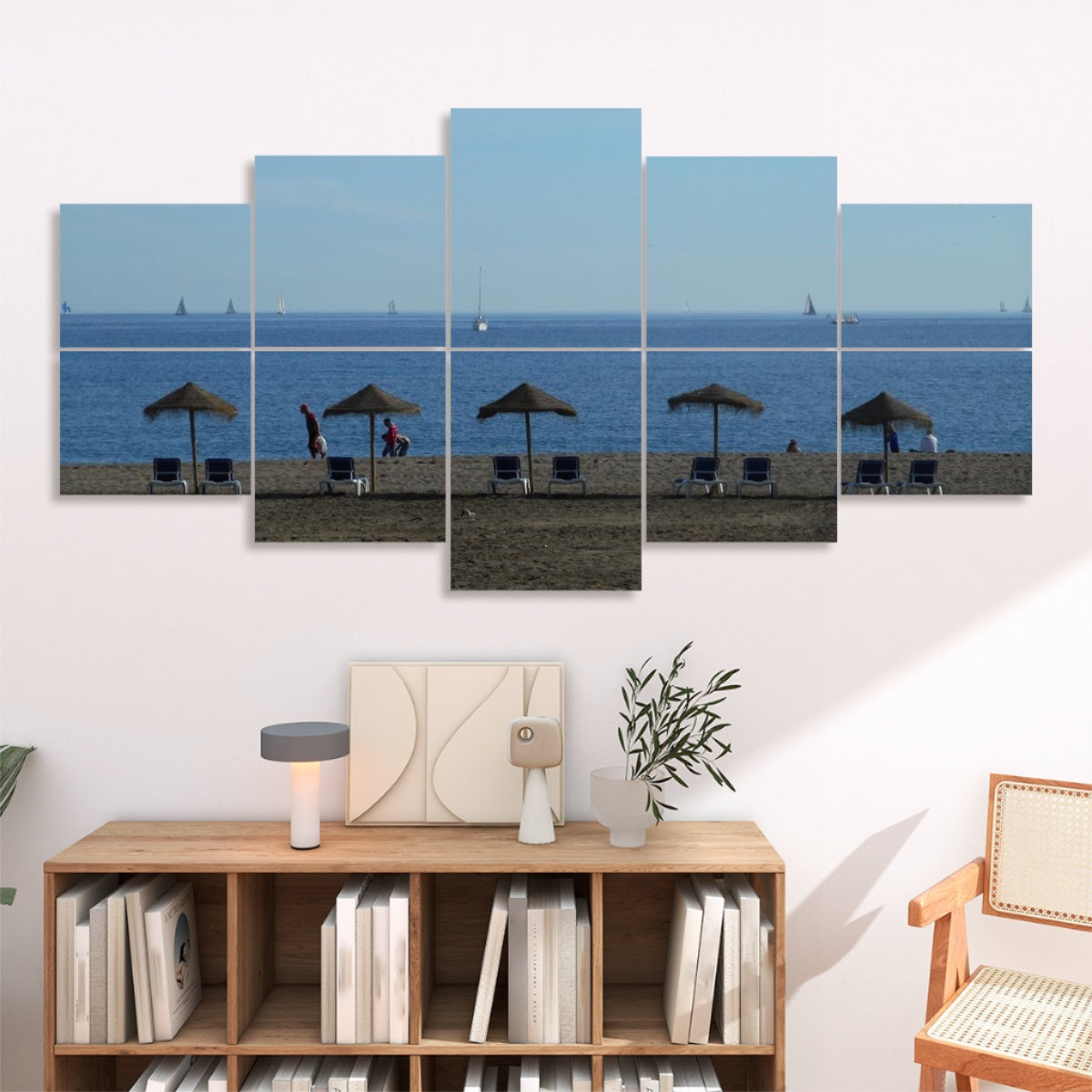 10 panels showing a Málaga beach scene with straw umbrellas and lounge chairs on sandy shore sailboats dotting the blue horizon