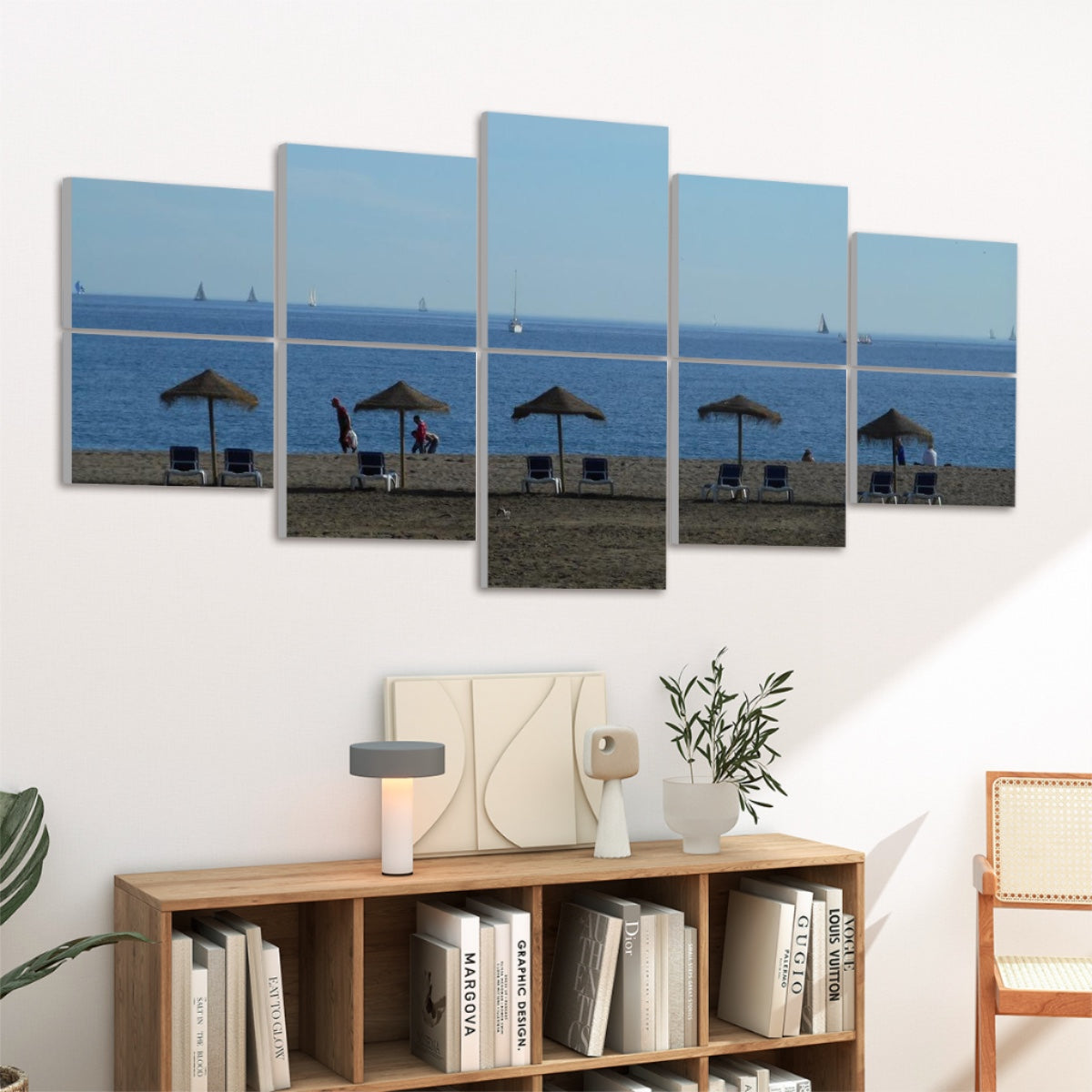 angled view of 10 panels featuring a Málaga beach scene above a wood console in a modern living room