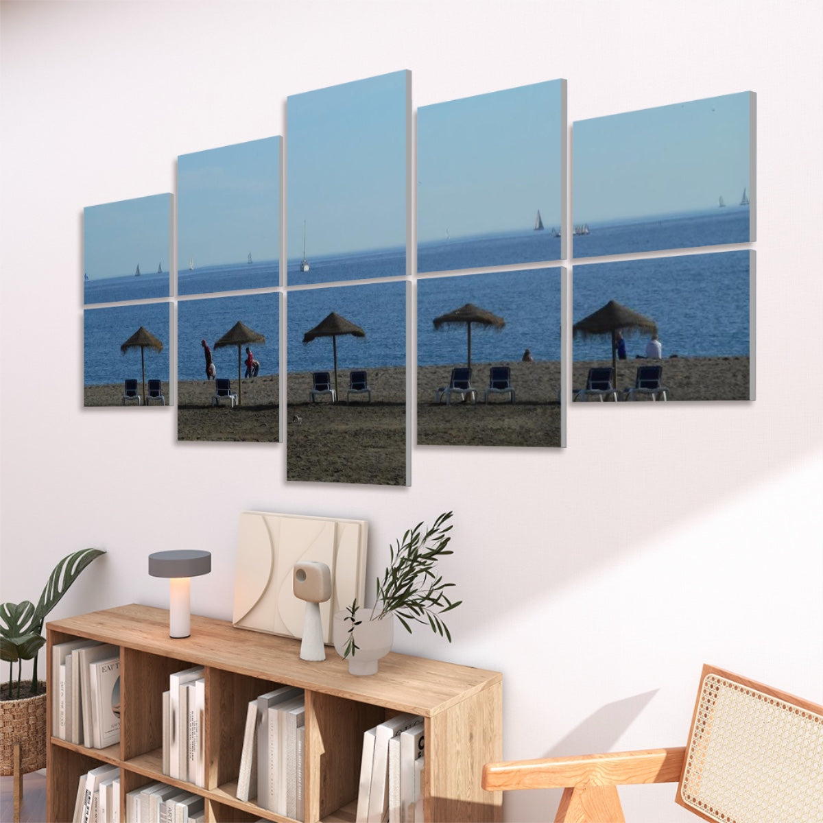 angled view of 10 panels featuring a Málaga beach scene above a wood console in a modern living room