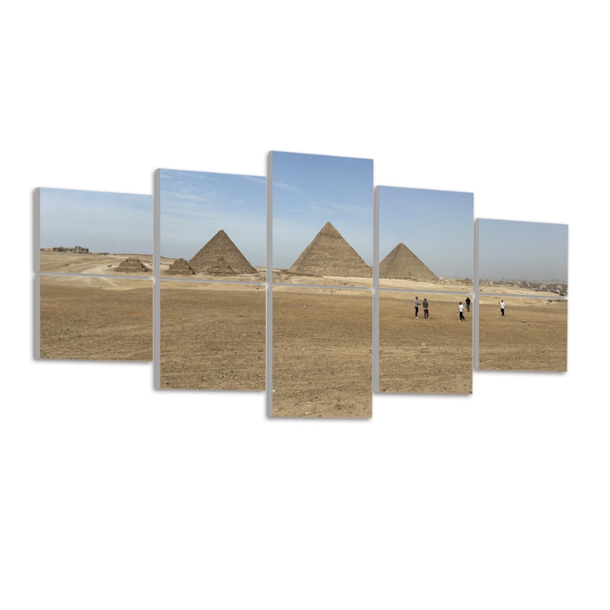 Angled view of the Giza pyramids and desert horizon under a soft blue sky