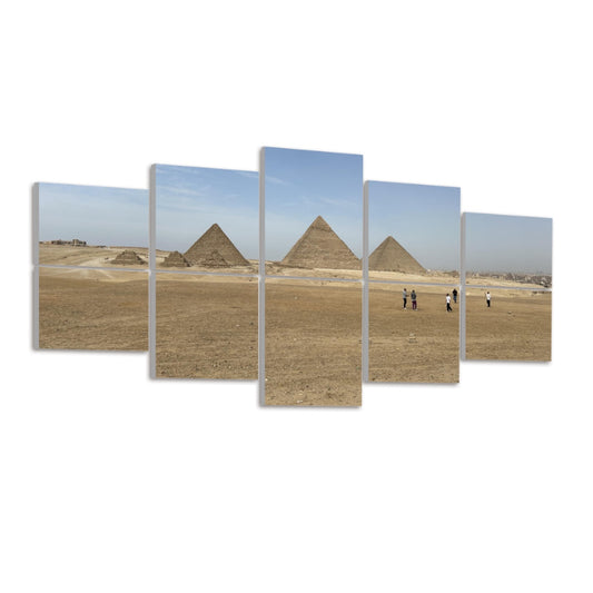 Angled view of the Giza pyramids and desert horizon under a soft blue sky