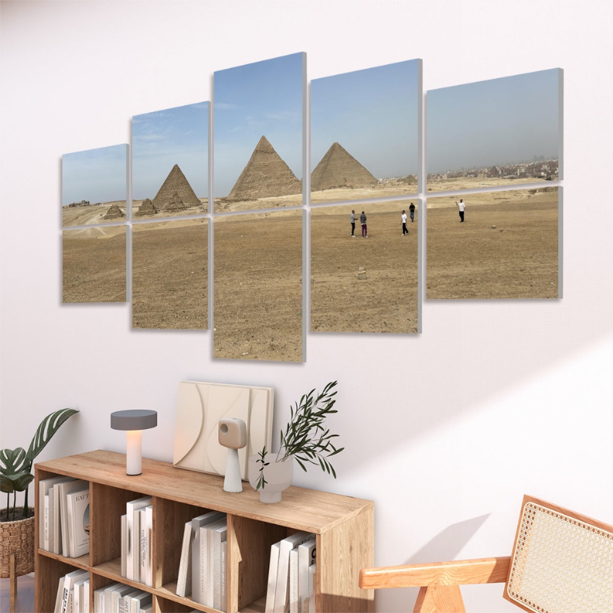 Right-angled view showing the Giza pyramids and wide sandy foreground under clear light