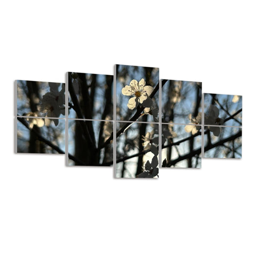 Left-angled view of 10 acoustic panels featuring backlit white flowers against tree branches and pale blue sky in full color.