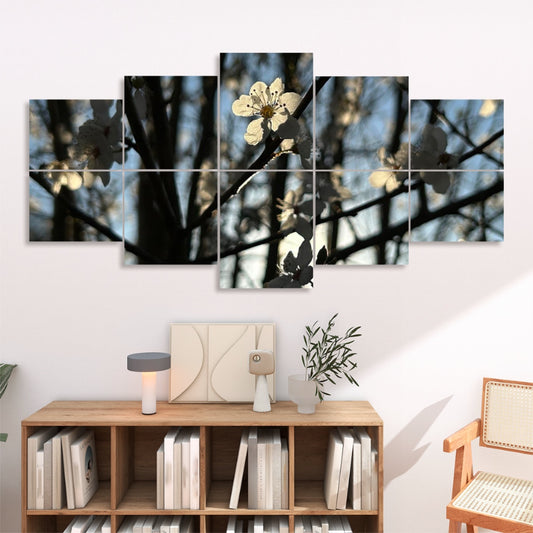 White blossoms glowing in backlight among tree branches with soft blue sky, shown in full color across 10 decorative sound absorbing wall panels.