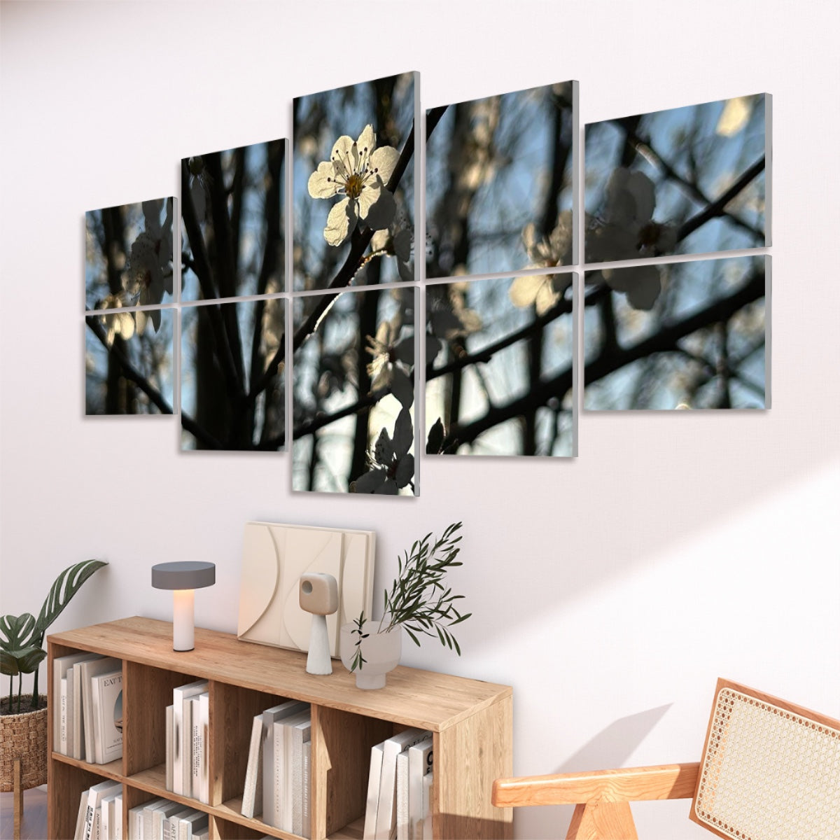 Right-angled view of 10 decorative sound absorbing wall panels with softly glowing blossoms and silhouetted branches in full color.