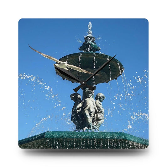Acrylic wall clock featuring seagull in flight, blue sky and fountain in Lisbon