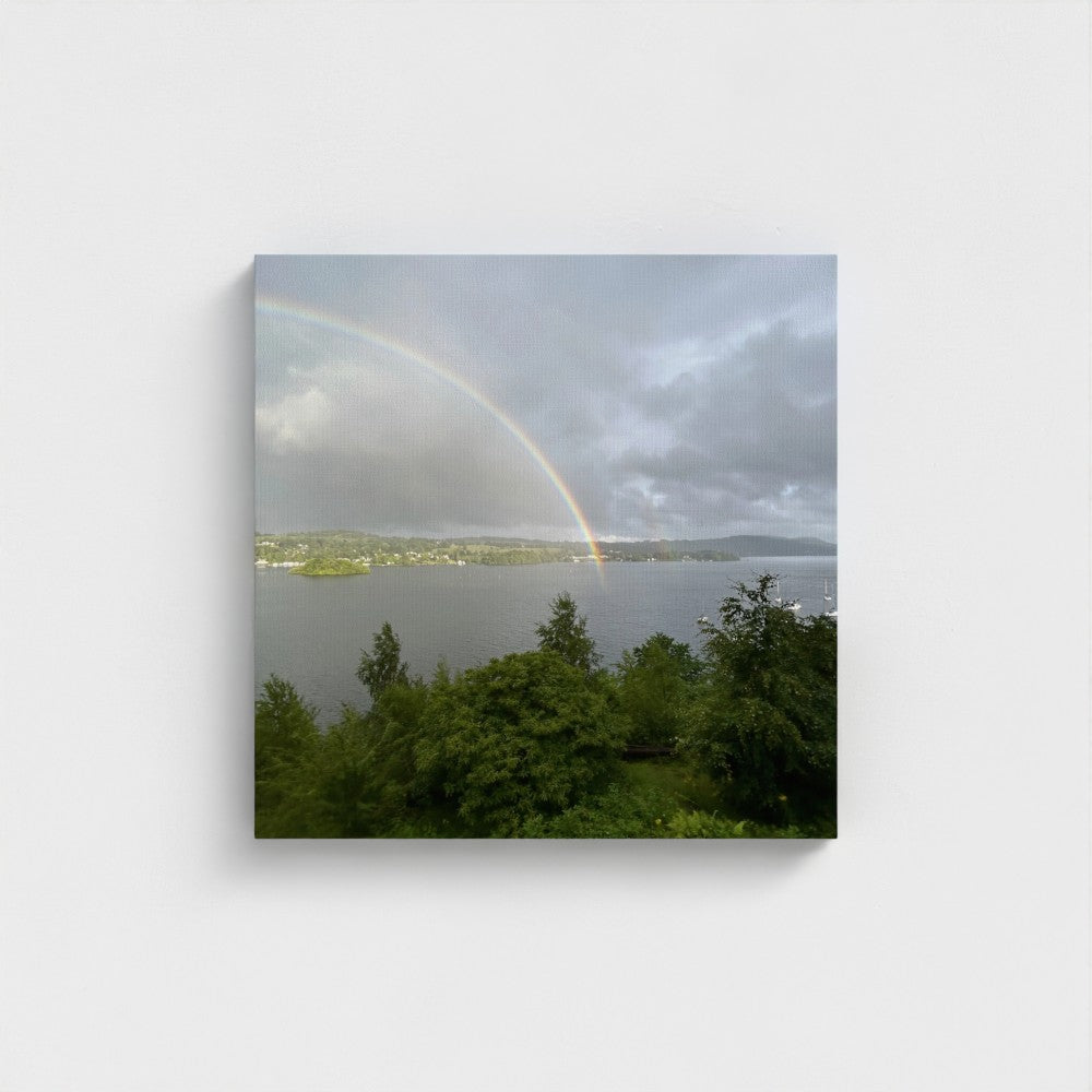 Windermere Rainbow Recycled Wall Art Lake District Landscape centered rainbow arch above textured water, soft diffused light and rich