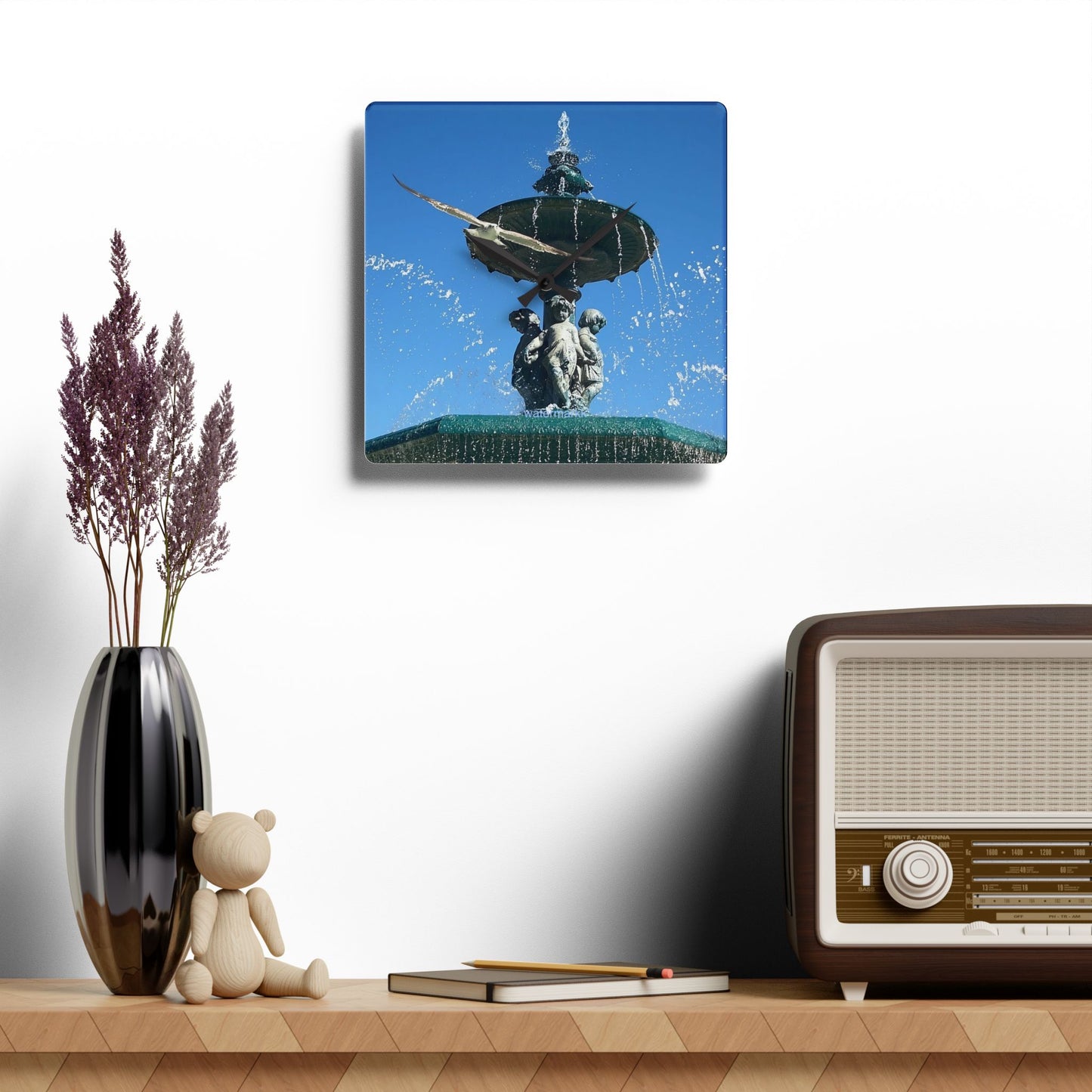 Acrylic wall clock featuring seagull in flight, blue sky and fountain in Lisbon