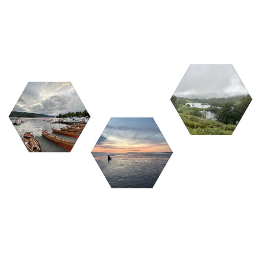 3 Hexagonal Decorative Sound Absorbing Wall Panels Set with three landscape prints of boats on lake sunset sea