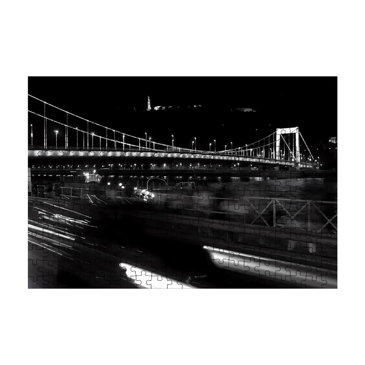 Full color photograph of a historic bridge in Budapest with elegant architecture and river scenery.