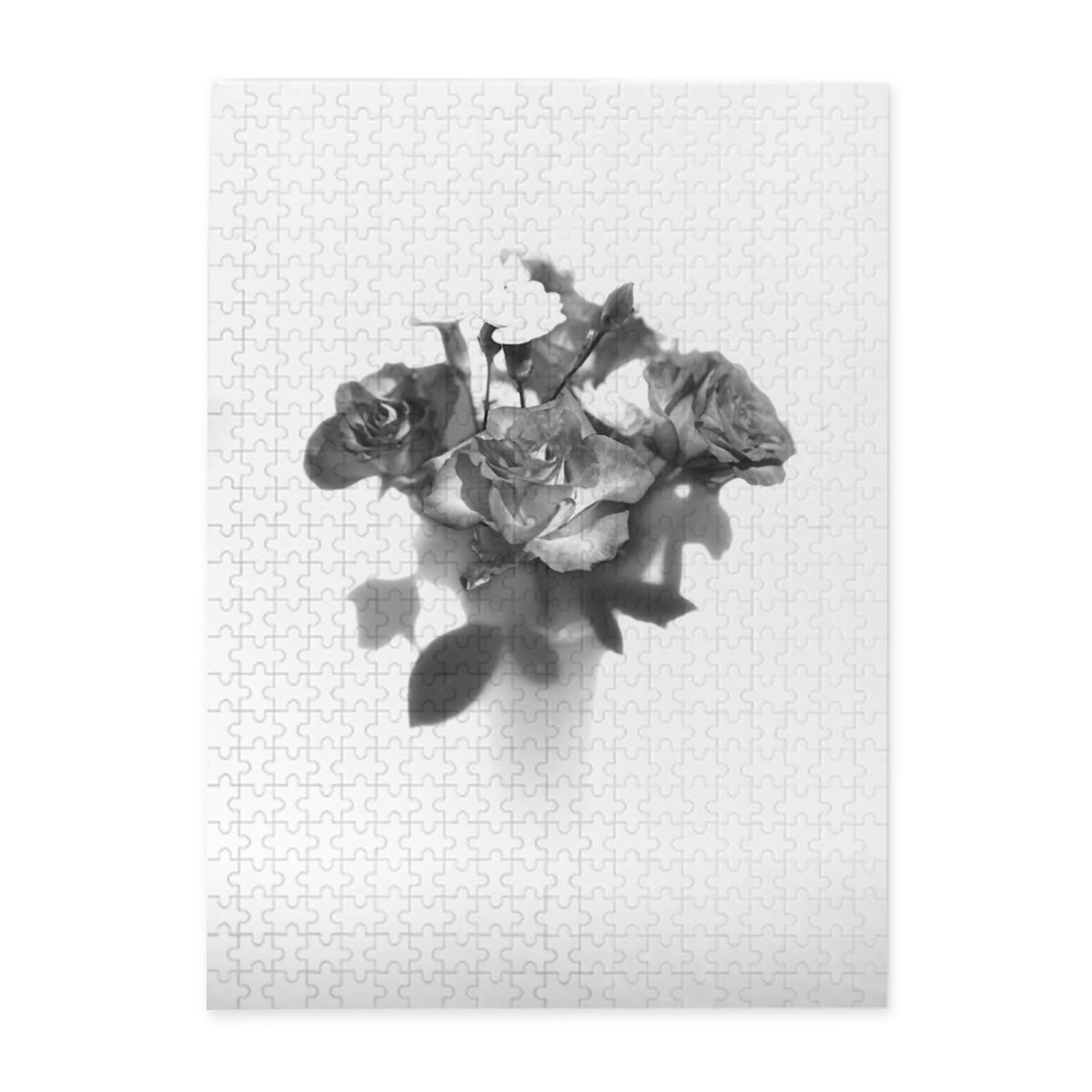 Front view of the 500‑piece wooden jigsaw puzzle box showing a greyscale rose bouquet image, labelled 20.5 × 15 inches, basswood pieces.