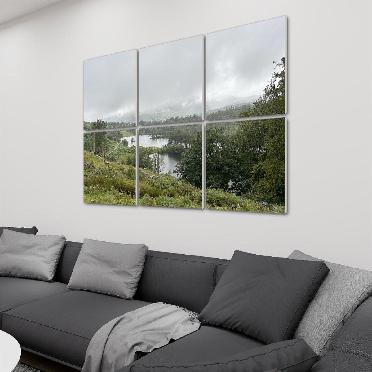 6 Decorative Sound Absorbing Wall Panels featuring Tarn Hows Lake District Landscape. Mounted above gray sofa
