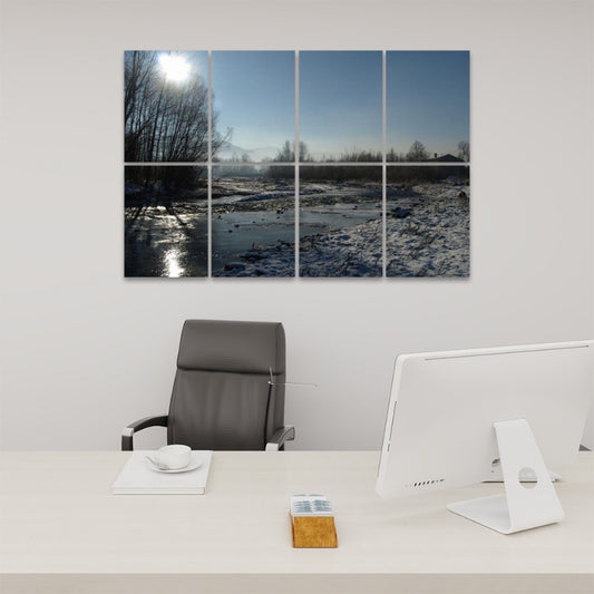 Front view of 8-panel acoustic wall art showing a snow-covered stream with bare trees and sunlight reflecting off the water.