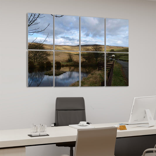 Left-angle view of full color 8-panel British Countryside wall art showing soft hill textures, pond reflections, and leafless trees.