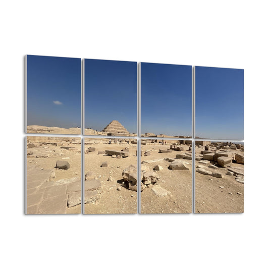 Step Pyramid of Djoser at Saqqara under a clear blue sky, with ruins in the foreground, shown on 8 decorative sound absorbing wall panels. left angle