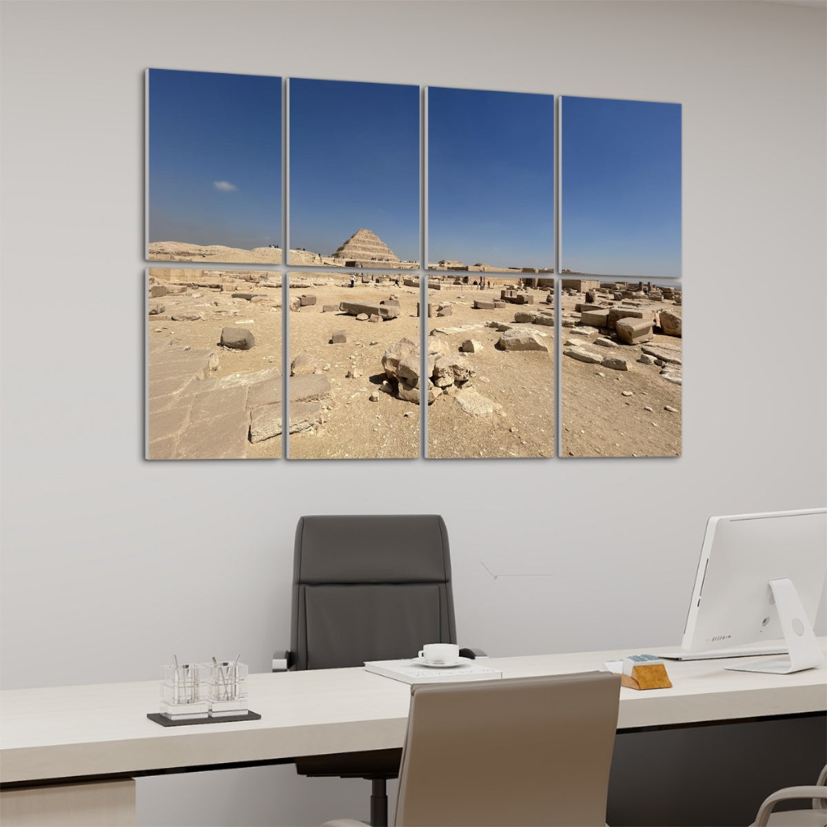 Step Pyramid of Djoser at Saqqara under a clear blue sky, with ruins in the foreground, shown on 8 decorative sound absorbing wall panels. left angle