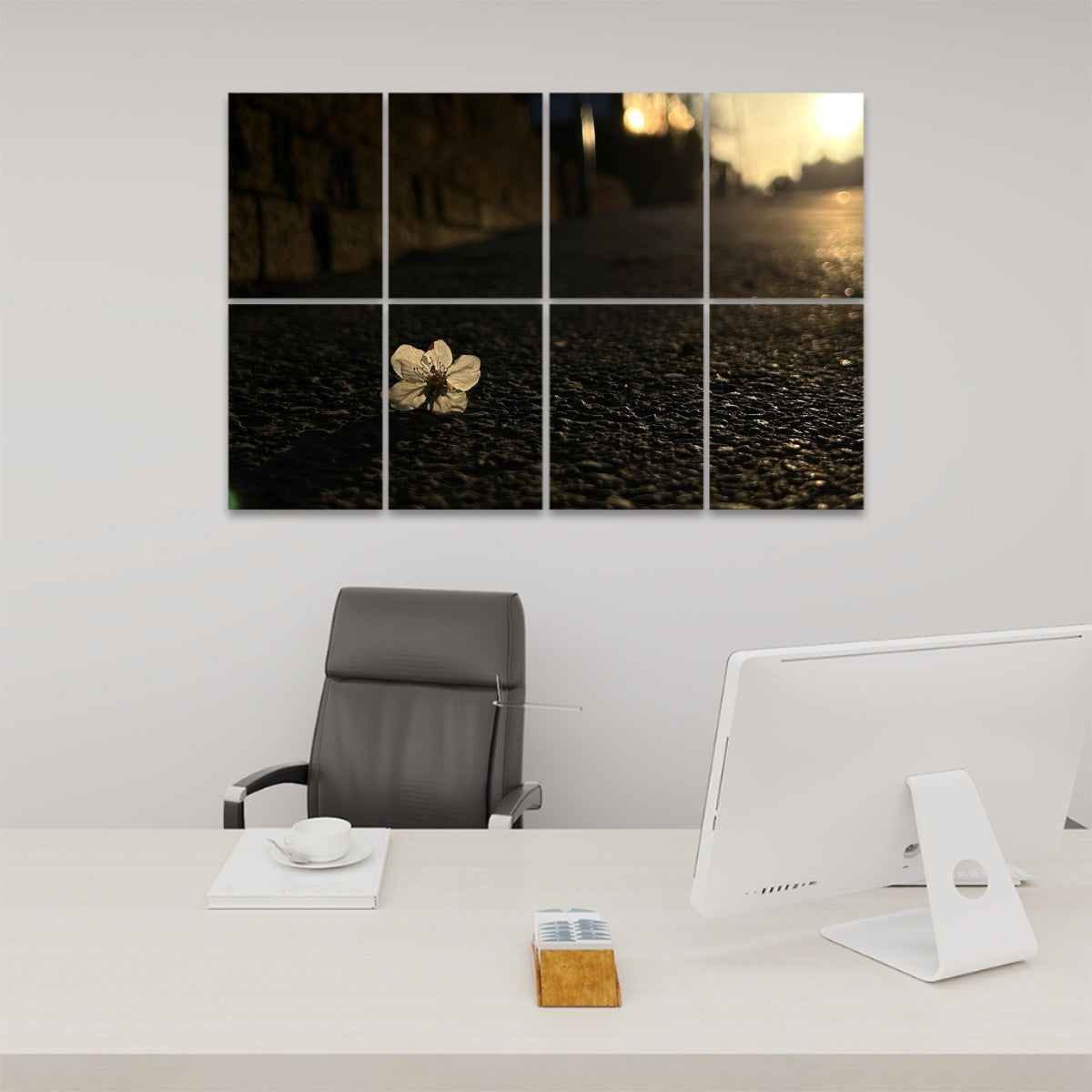Full-color acoustic wall panels showing a white flower resting on asphalt at sunset, with golden light and deep shadows, arranged across 8 panels.