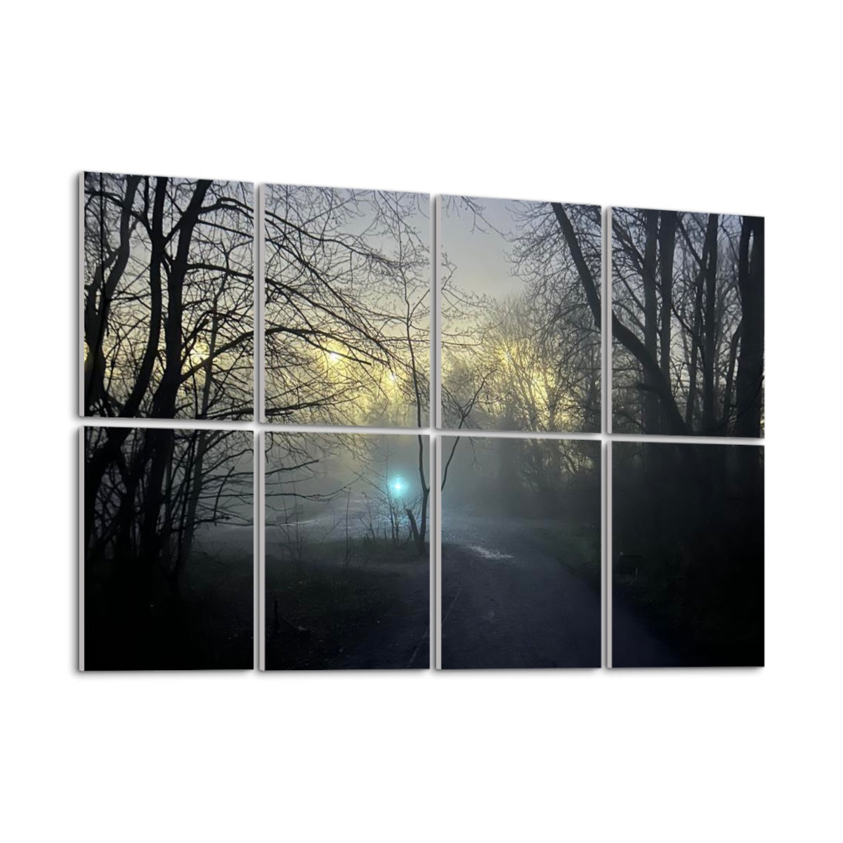 Angled left-side view of full-color foggy forest path with mist, silhouetted trees, and soft glowing light across 8 acoustic wall panels.