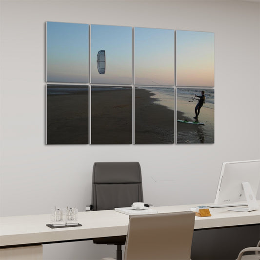 left angle. Kitesurfer on wet sand at sunset, holding lines with the kite above and the sky fading from blue to warm hues, spanning 8 decorative acoustic panels.
