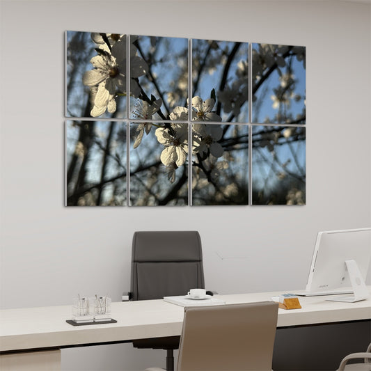 Left angle of 8-panel floral wall art showing blooming white blossoms and shadows against a bright blue spring sky.