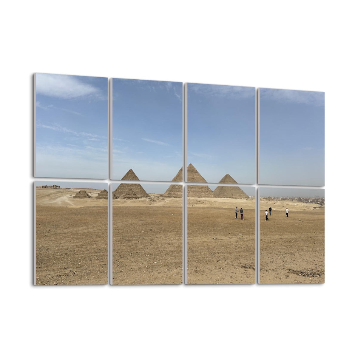 Wide desert landscape with people walking toward the Pyramids of Giza under a blue sky, printed across 8 sound-absorbing wall panels. left angle view