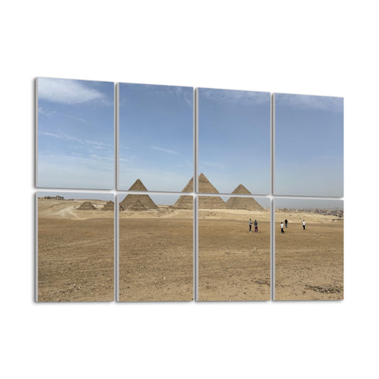 Wide desert landscape with people walking toward the Pyramids of Giza under a blue sky, printed across 8 sound-absorbing wall panels. left angle view