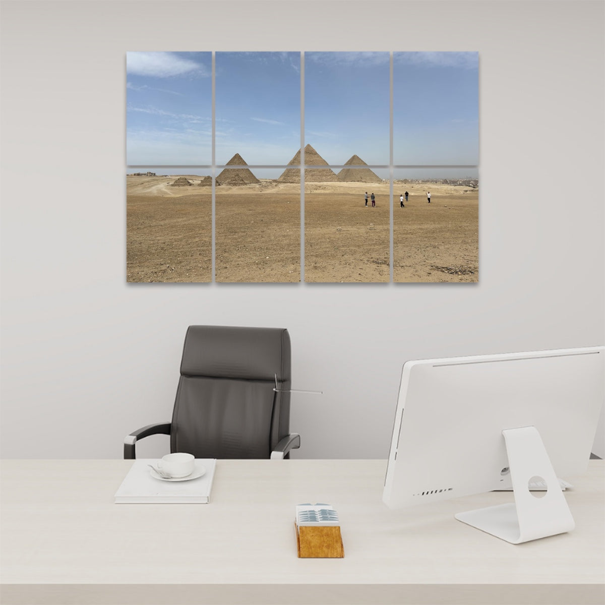 Wide desert landscape with people walking toward the Pyramids of Giza under a blue sky, printed across 8 sound-absorbing wall panels. front view