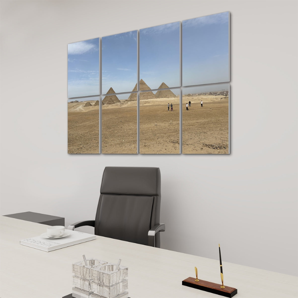 Wide desert landscape with people walking toward the Pyramids of Giza under a blue sky, printed across 8 sound-absorbing wall panels. right angle view
