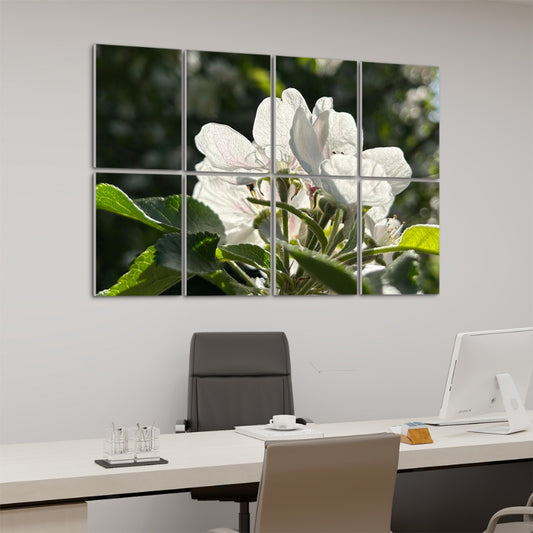 Left angle view of floral acoustic panels featuring white blossoms and fresh green leaves lit by afternoon sun.