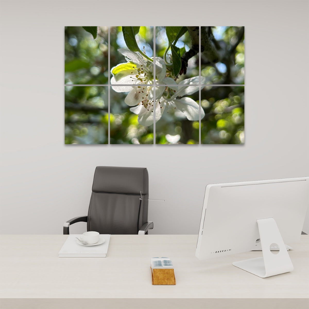 Brightly lit close-up of a white flower with translucent petals and blurred green background, divided between 8 floral sound absorbing wall panels.