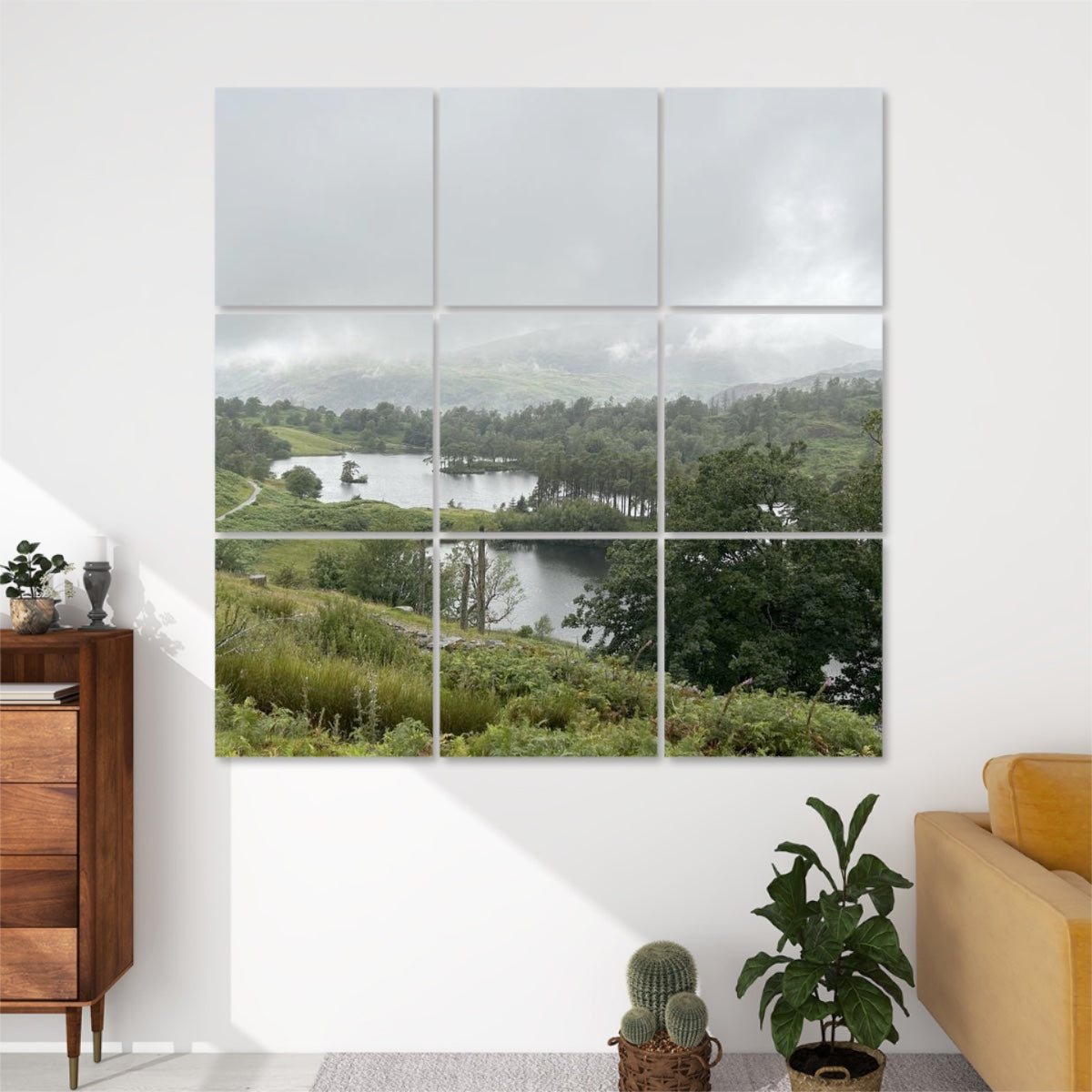 9 Decorative Sound Absorbing Wall Panels Featuring Tarn Hows Lake. 3x3 canvas grid of misty lake landscape above sofa