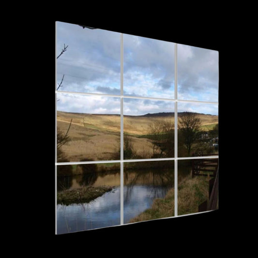Left-angle view of British Countryside acoustic wall panels showing pond reflections, hillside light, and depth of the panel grid.