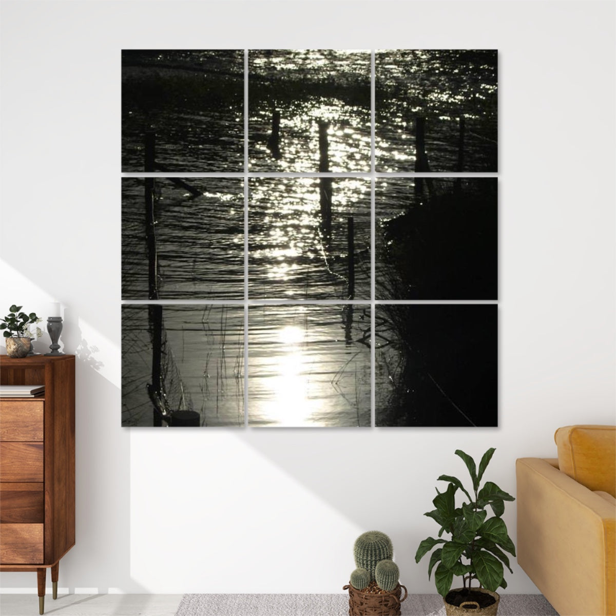 Front view of 9-panel acoustic wall art showing shimmering water reflecting bright light, with silhouetted fence posts and grasses in a moody, abstract scene.