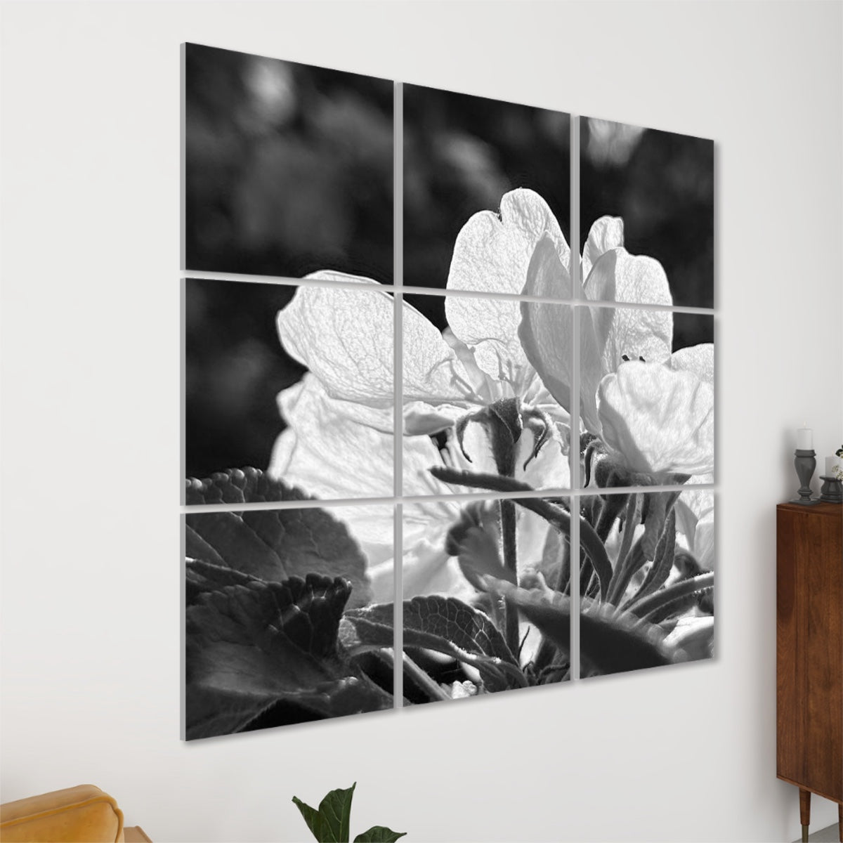 Angled left-side view of grayscale acoustic panels showing textured flower petals in black and white with deep contrast.
