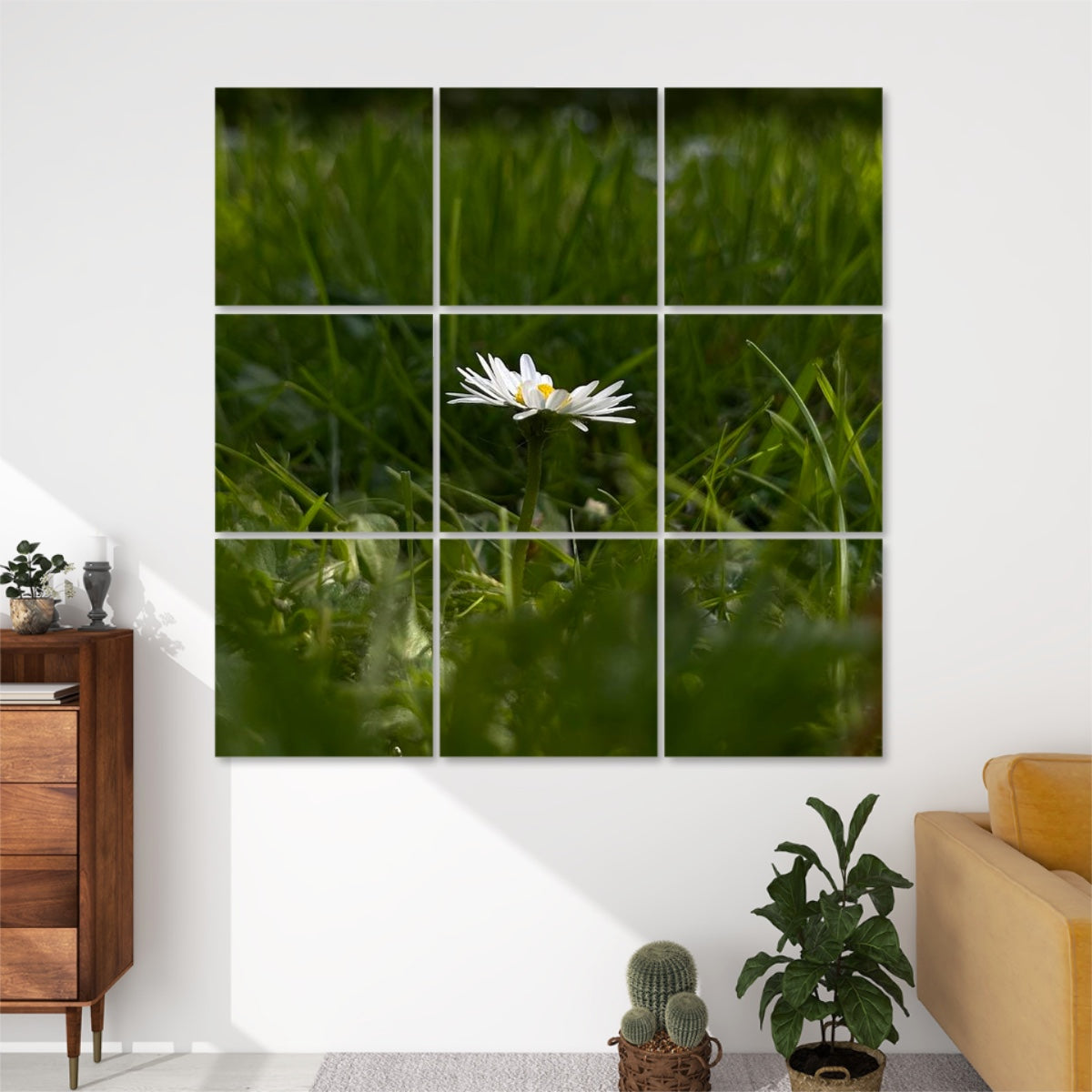 Close-up of a single white daisy standing in green grass under soft daylight, split across 9 decorative sound absorbing wall panels.