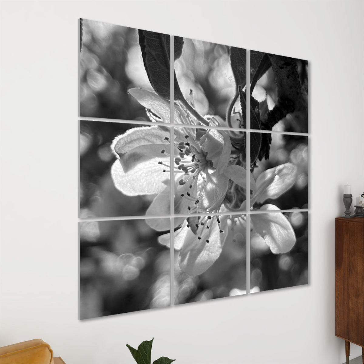 Left angle view ofrayscale version of 9 acoustic panels showing a softly glowing flower with warm highlights and gentle petal detail.