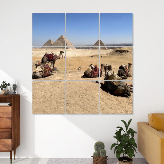 Front view of 9‑panel acoustic wall art showing camels resting on desert sands before the Pyramids of Giza under a clear blue sky.