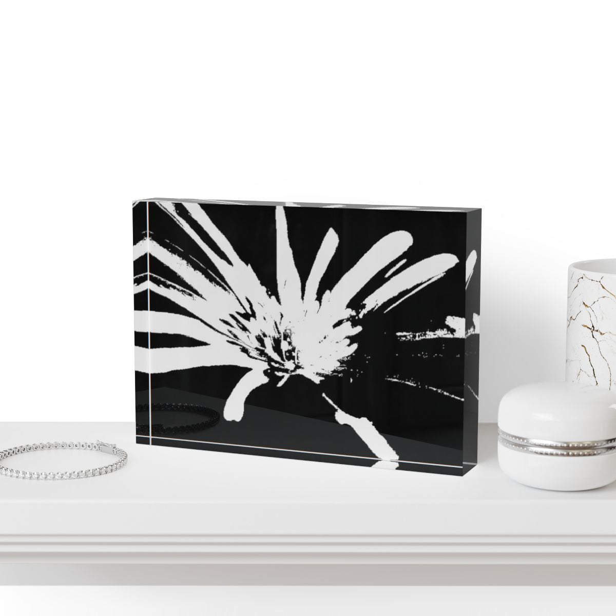 Black and white acrylic photo block showing a Purple Anemone in high contrast tones, printed on crystal-clear acrylic with deep vinyl backing.