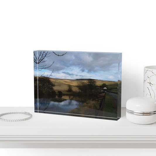 Acrylic photo block featuring a full color rural landscape with golden hills, pond reflections, and moody skies, printed on clear acrylic.