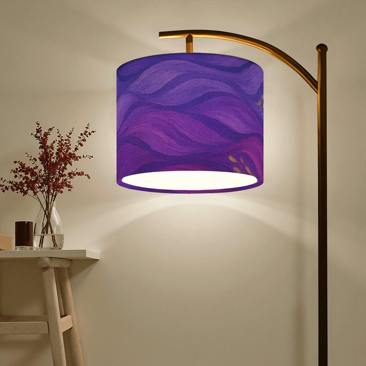 Arc floor lamp with black metal base and gilded arm; linen shade in swirling purple, magenta, and gold wave pattern.
