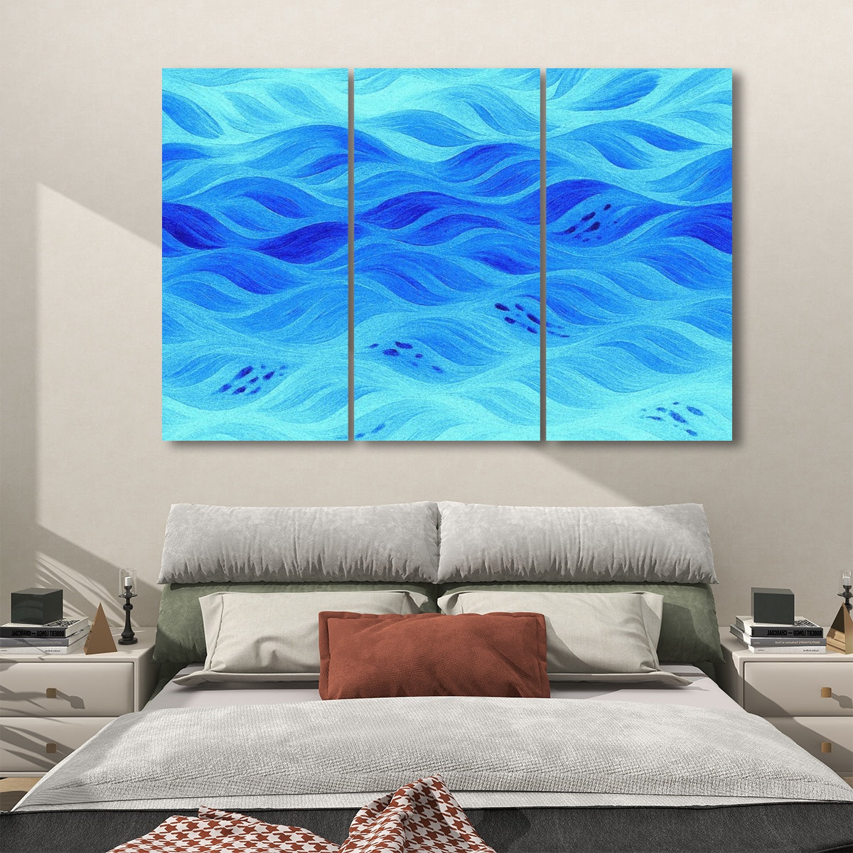 Three decorative acoustic panels in soft azure blue tones with flowing abstract design, displayed above a modern bed.
