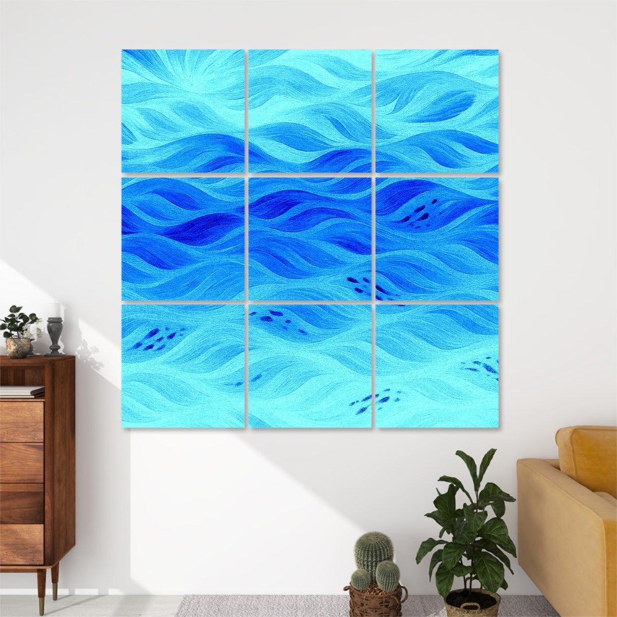Nine panels in sky-to-sea blue gradients forming a calming wave pattern on a white wall