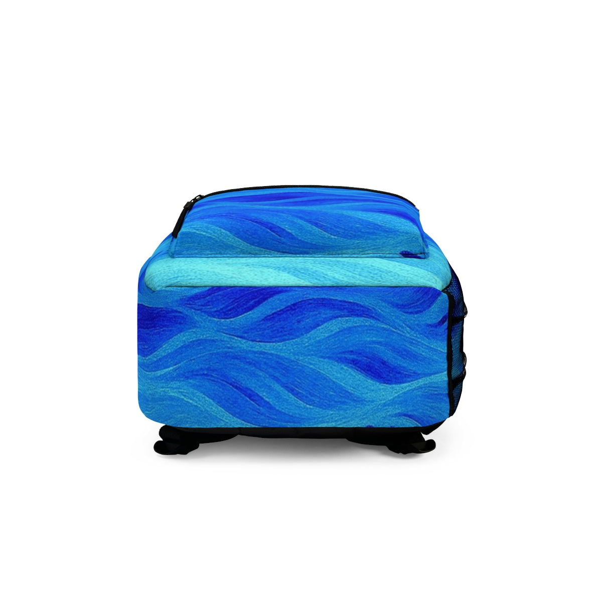 Bottom panel of the backpack in soft turquoise and royal blue, lightly curved with clean seams and wave design visible