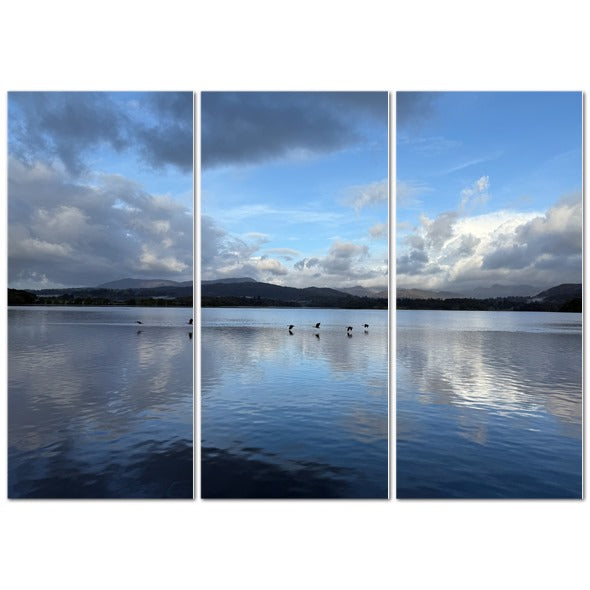 Stunning triptych of Birds Flying Over Windermere Lake - Lake District Landscape with calm waters and clouds