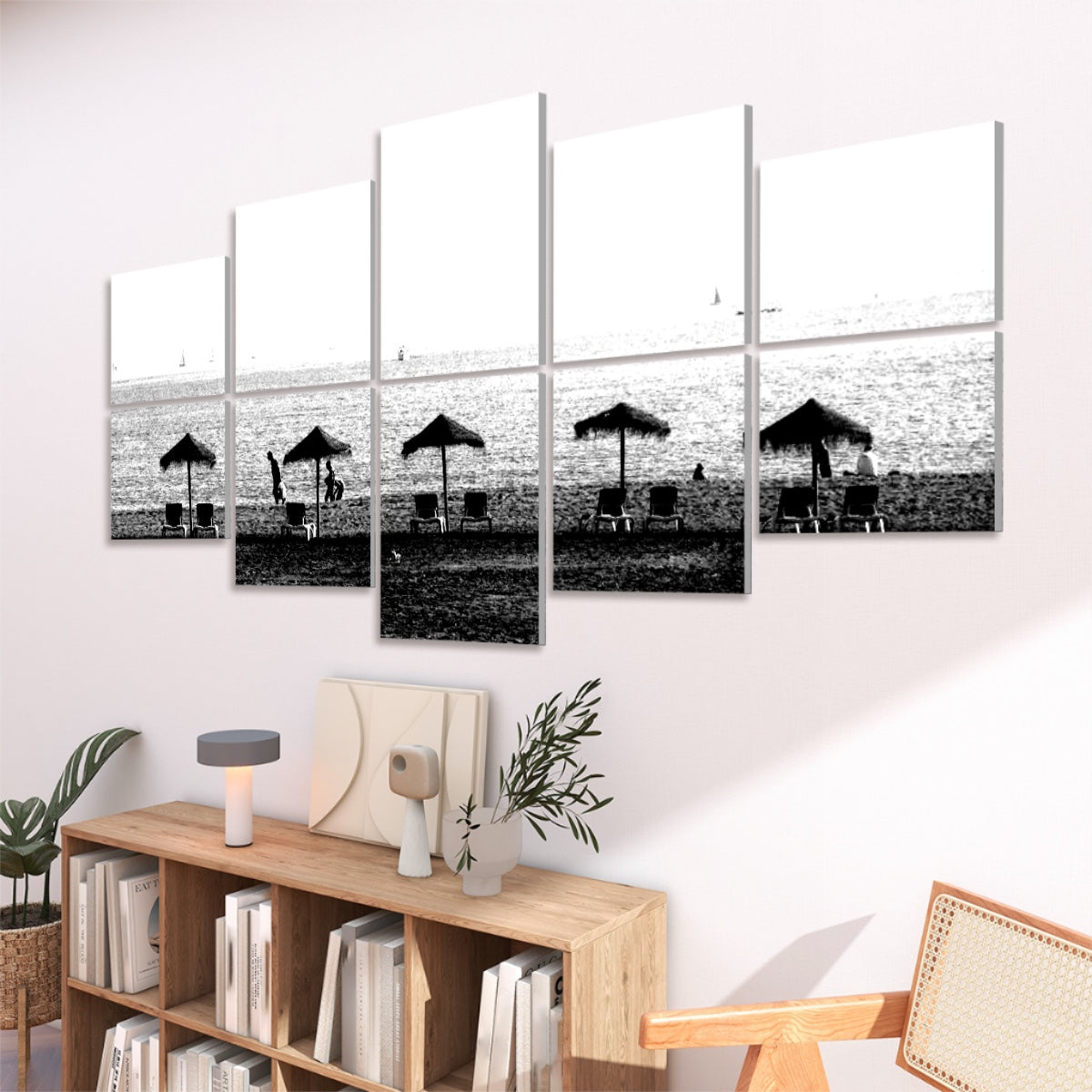 10 panels in black and white showing a Málaga beach with umbrellas chairs and sailboats outlined against the sea, angled view